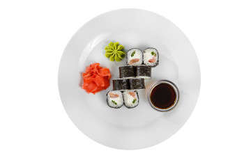 Sushi, rolls, hosomaki with salmon and philadelphia cheese, soy sauce, marinated ginger and wasabi, white isolated background, view from above