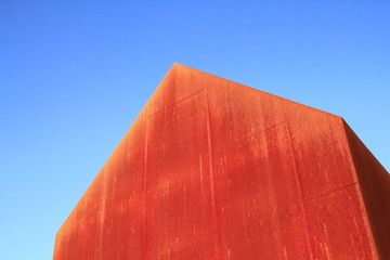 Contemporary rusty building with blue sky 