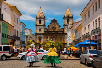 Bright view of Pelourinho in Salvador, Brazil, dominated by the large colonial Cruzeiro de Sao Francisco Christian stone cross in the Pra a Anchieta