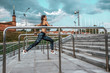 © byswat - Girl on morning run summer city on background steps of clouds and metal handrails. Fitness sport, active lifestyle of young people. Motivation is power, achievement, success. Free space.