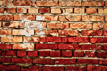 Worn Red Brick Wall Hald Of Deep Red Color