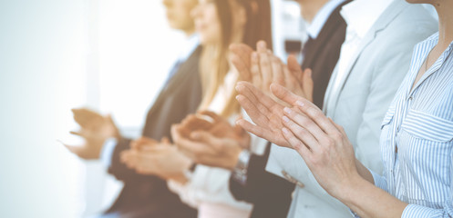 business people clapping and applause at meeting or conference, close-up of hands. group of unknown 
