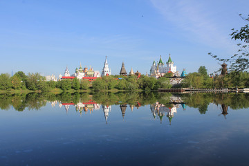 Kremlin in Izmailovo in Moscow Russia early spring morning with reflection in the blue water of the pond