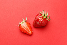 Ripe Juicy Strawberries On A Red Background. Pattern. Creative Summer Background Composition With Strawberry. Minimal Fruit Concept.