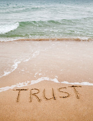 Wall Mural - Word trust written on the sand