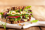Fototapeta  - Fresh vegetarian  sandwich  with cheese and veggies.