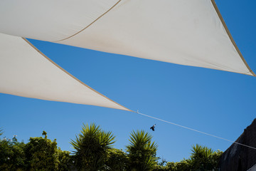 awnings for the sun in the yard of the house