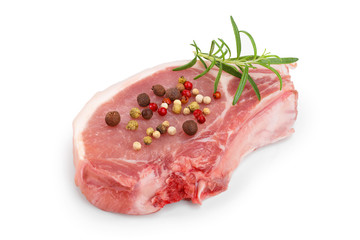 sliced raw pork meat with rosemary and peppercorn isolated on white background