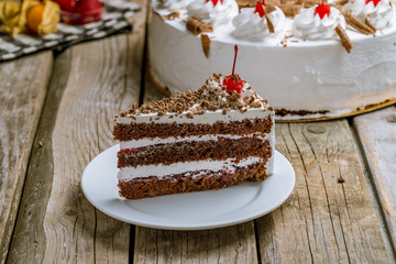 Sticker - black forest cake on wooden background