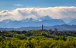 Landscape of the Monferrato hills with the Alps as a background. Telephoto from Don Bosco Hill in the province of Asti, Italy. Far away on the right you can see the Basilica of Superga.
