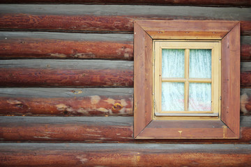 A window in old wooden house as background