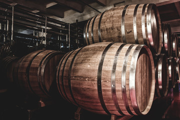 Fototapete - Wooden barrels with whiskey in dark cellar