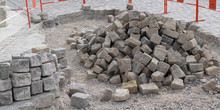 Pile Of Processed Pieces Of Granite Prepared For Work On Paving Cobblestones Street Works