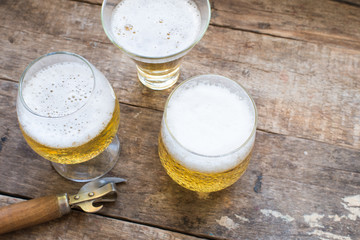 glass of beer on wooden table