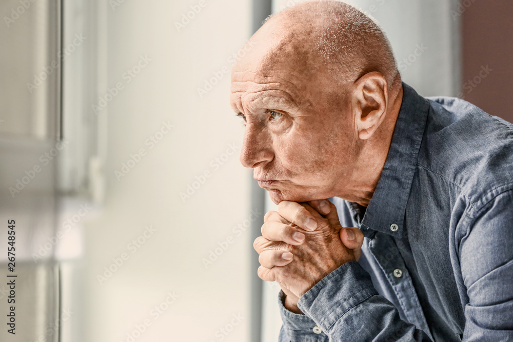 Depressed senior man at home