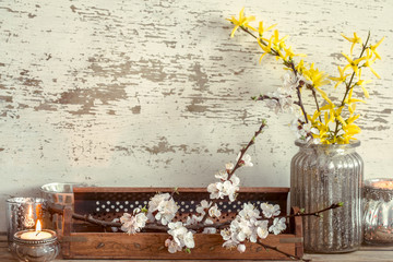 Home decor on wooden background with spring flowers