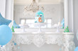 © avikki - Children birthday decorations. A lot of balloons blue and green colors.