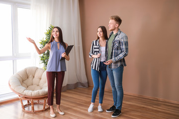 Sticker - Real estate agent showing young couple a new house