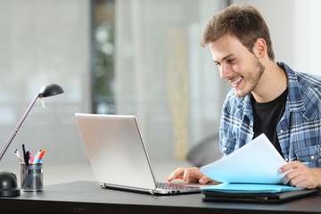 Man working online at home on a laptop