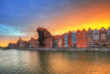 Fototapeta  - Old town of Gdansk with historic Port crane over Motlawa river at sunset, Poland.