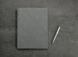 © worldofstock - Note pad, diary, ring binder with pen on gray stone background