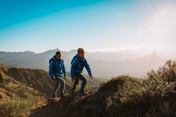 father and son hiking in scenic mountains