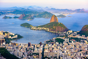 Fototapete - The mountain Sugarloaf and Botafogo in Rio de Janeiro, Brazil. One of the main landmark of Rio de Janeiro. Sunset skyline of Rio de Janeiro