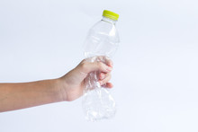 Hand Holding Plastic Bottles For Recycling To Conserve The Environment.