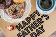 Greeting card with donuts and a cup of coffee for Fathers day.