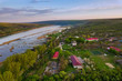 © Igor Syrbu - Arial view over the river and small village.