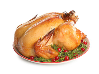 Platter of cooked turkey with garnish on white background