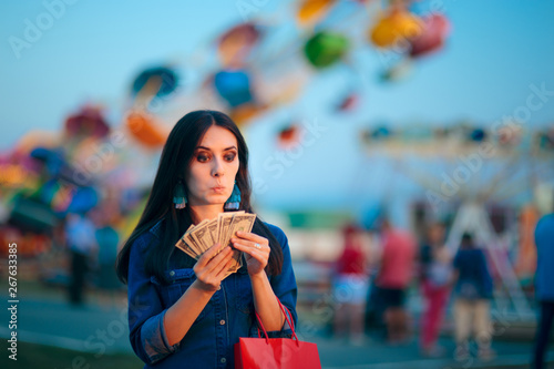 Cuadros en Lienzo Woman Holding Cash Money at Summer Funfair