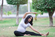© reewungjunerr - Portrait of asian Beautiful pregnant woman at the park,Thailand people,Happy woman concept,Her play yoga on the lawn
