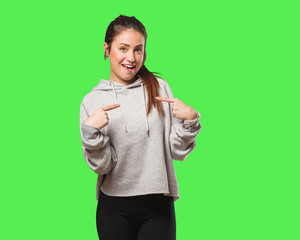 Young fitness woman surprised, feels successful and prosperous