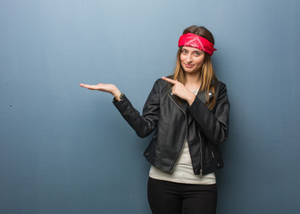 Wall Mural - Young russian woman holding something with hand