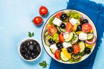 Sticker - Greek salad on blue table.