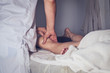 © Artem - Physiotherapist doing legs massage to her patient in medical office.