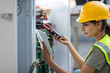 © Westend61 - Female technician working on a box with circuit boards