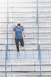 © MCStock - Hispanic Man Running Up the Stairs.