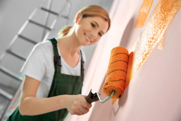 Poster - Professional decorator painting wall indoors. Home repair service