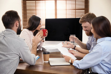 Poster - Group of colleagues using video chat on computer in office. Space for text