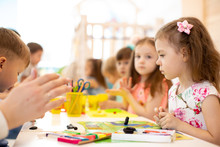 Kids Group Learning Arts And Crafts In Kindergarten Or Day Care Centre