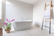 © Stock PK - Luxury bathroom features bathtub with flower