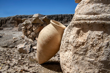 Amphora leaning against the ruin of a building in the ancient city of Zipory, National Park, Israel.