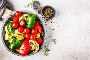 Wall Mural - Grilled vegetables (peppers, zucchini, mushrooms and tomatoes in pan, white background.