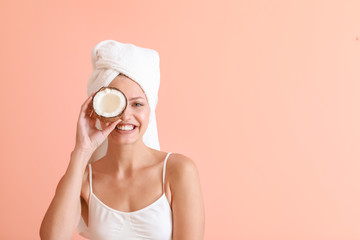 Sticker - Beautiful young woman with coconut on color background