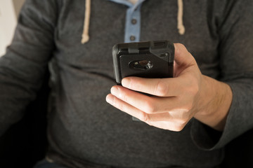 man using his smartphone, mobile, waiting for message