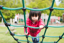 Toddler Girl Play At Outdoor Playground