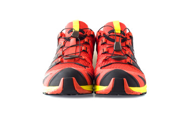 Wall Mural - Front view of red trail running shoes isolated on white background