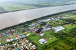Bird's-eye view of the suburbs of Georgetown and the river Demerara, rum factory, taken from the plane, Guyana.